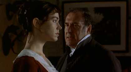 A man and woman in 1800s British formal clothing having a tense conversation.